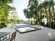 Community pool and hot tub surrounded by lush landscaping for relaxation and recreation at 208 Frinton Cv, Longwood, FL 32779