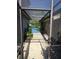 Pathway leads to screened lanai and pool area at 208 Frinton Cv, Longwood, FL 32779