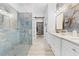 Luxurious bathroom featuring a stunning blue tile shower and walk-in closet at 2108 Antilles Club Dr, Kissimmee, FL 34747