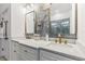 Modern bathroom with double sinks, quartz counters, and decorative mirrors at 2108 Antilles Club Dr, Kissimmee, FL 34747