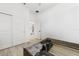 Bright bedroom featuring wood-look tile flooring, and an ensuite bathroom at 2108 Antilles Club Dr, Kissimmee, FL 34747