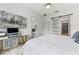 Bright bedroom with a white desk and sliding door to the closet at 2108 Antilles Club Dr, Kissimmee, FL 34747