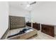 Spacious bedroom with wood-look flooring, a ceiling fan, and dark wood furniture at 2108 Antilles Club Dr, Kissimmee, FL 34747