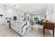 Bright, modern kitchen with large marble island, stainless steel appliances, and an open layout at 2108 Antilles Club Dr, Kissimmee, FL 34747