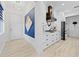 Modern kitchen features sleek white cabinets and stainless steel appliances at 2108 Antilles Club Dr, Kissimmee, FL 34747