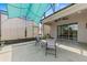 Screened-in lanai with a table and chairs under a turquoise sunshade at 2108 Antilles Club Dr, Kissimmee, FL 34747
