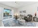 Inviting living room with stylish furniture and a serene view of the outdoor patio at 2108 Antilles Club Dr, Kissimmee, FL 34747