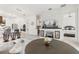 Open-concept living room showcasing a modern fireplace and seamless flow into the kitchen at 2108 Antilles Club Dr, Kissimmee, FL 34747