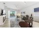 Bright living room with marble accents, modern fireplace, and access to a screened-in lanai at 2108 Antilles Club Dr, Kissimmee, FL 34747