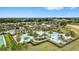 This aerial shot captures the community pool, clubhouse, and lush landscaping at 2108 Antilles Club Dr, Kissimmee, FL 34747