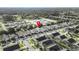 Drone shot of the community featuring homes with screened in pools and RV parking close by at 2115 Morning Star Drive, Clermont, FL 34714