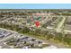 Aerial view of homes, a pool and an RV storage lot, with trees, streets, and homes at 2115 Morning Star Drive, Clermont, FL 34714