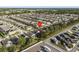Aerial view of the neighborhood with houses, pools, and RV parking at 2115 Morning Star Drive, Clermont, FL 34714