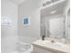 Bright bathroom featuring a large soaking tub, walk-in shower, and a single sink vanity with ample counter space at 2115 Morning Star Drive, Clermont, FL 34714