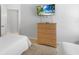 Bedroom with two beds, TV, closet, and view of the en-suite bathroom at 2115 Morning Star Drive, Clermont, FL 34714