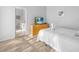 Well-lit bedroom featuring a queen-sized bed and a modern dresser with TV at 2115 Morning Star Drive, Clermont, FL 34714