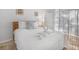Cozy bedroom featuring a queen-sized bed with a swan towel arrangement at 2115 Morning Star Drive, Clermont, FL 34714