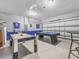 Spacious bonus room featuring an air hockey table and a pool table for entertainment at 2115 Morning Star Drive, Clermont, FL 34714