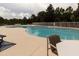 Inviting community pool with ample seating and a serene atmosphere, ideal for leisure at 2115 Morning Star Drive, Clermont, FL 34714