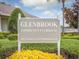 Glenbrook Community Clubhouse sign surrounded by lush landscaping creates a welcoming entrance for guests at 2115 Morning Star Drive, Clermont, FL 34714