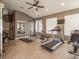 Well-equipped fitness center features modern exercise machines and ample workout space at 2115 Morning Star Drive, Clermont, FL 34714