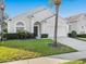 Charming single-story home with a well-maintained lawn, mature landscaping, and a two-car garage at 2115 Morning Star Drive, Clermont, FL 34714