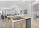 Open concept kitchen with island, sink, dishwasher and view of the living room at 2115 Morning Star Drive, Clermont, FL 34714