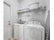Bright laundry room with a washer, dryer, shelving, and plenty of space at 2115 Morning Star Drive, Clermont, FL 34714