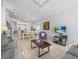 Open-concept living room with tile flooring, neutral colors, and entertainment center at 2115 Morning Star Drive, Clermont, FL 34714