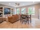 Bright living room with comfortable seating, large windows, and tiled floors at 2115 Morning Star Drive, Clermont, FL 34714