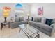 Comfortable living room featuring neutral paint, tile floors, and stylish decor at 2115 Morning Star Drive, Clermont, FL 34714