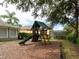 Community playground featuring slide, climbing structure, and plenty of space to play at 2115 Morning Star Drive, Clermont, FL 34714