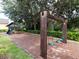 Community playground featuring swings and a play structure in a lush, landscaped setting at 2115 Morning Star Drive, Clermont, FL 34714
