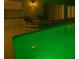 Swimming pool with lounge chairs and poolside lighting at 2115 Morning Star Drive, Clermont, FL 34714