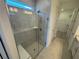 Modern bathroom features include glass shower, bright lighting and walk in closet at 2333 Daisy Tree Rd, St Cloud, FL 34771