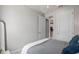 Bright bedroom with a neutral color scheme with an ensuite bathroom and walk-in closet at 2333 Daisy Tree Rd, St Cloud, FL 34771