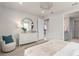 Cozy bedroom featuring a white dresser, modern decor, and a view into the hallway and bathroom at 2333 Daisy Tree Rd, St Cloud, FL 34771