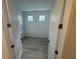 The bedroom offers a charming view and features wood floors that enhance the aesthetic appeal at 2333 Daisy Tree Rd, St Cloud, FL 34771