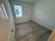 This cozy bedroom boasts natural light and sleek wood floors at 2333 Daisy Tree Rd, St Cloud, FL 34771