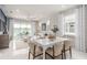 Open dining area seamlessly flowing into the living room and lanai, with plenty of natural light at 2333 Daisy Tree Rd, St Cloud, FL 34771