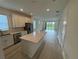 Modern kitchen with stainless appliances and a large island perfect for entertaining at 2333 Daisy Tree Rd, St Cloud, FL 34771