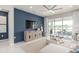 Cozy living room features modern furniture, stylish decor, and a view of the outdoors through large glass doors at 2333 Daisy Tree Rd, St Cloud, FL 34771