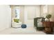 Bedroom with crib, a plush chair, and soft lighting create a cozy and comforting atmosphere at 2409 Bluestone Rd, Haines City, FL 33844