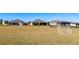 Community soccer field and green space with residential homes in the background at 2411 Bluestone Rd, Haines City, FL 33844