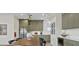 Open kitchen and dining area with modern appliances and ample cabinet space at 2411 Bluestone Rd, Haines City, FL 33844