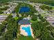 Gorgeous aerial shot of the community pool and surrounding lush landscape at 3174 Grasmere View Pkwy, Kissimmee, FL 34746