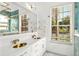 Bright bathroom with double vanity, stylish lighting, and modern fixtures at 3174 Grasmere View Pkwy, Kissimmee, FL 34746