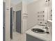 Stylish bathroom featuring double sinks, modern fixtures, and sleek countertops at 3174 Grasmere View Pkwy, Kissimmee, FL 34746