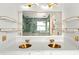 Bathroom features a white double vanity with gold sinks, ample countertop space, and modern lighting at 3174 Grasmere View Pkwy, Kissimmee, FL 34746
