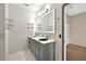 Modern bathroom featuring a double vanity, sleek lighting, and contemporary design elements at 3174 Grasmere View Pkwy, Kissimmee, FL 34746